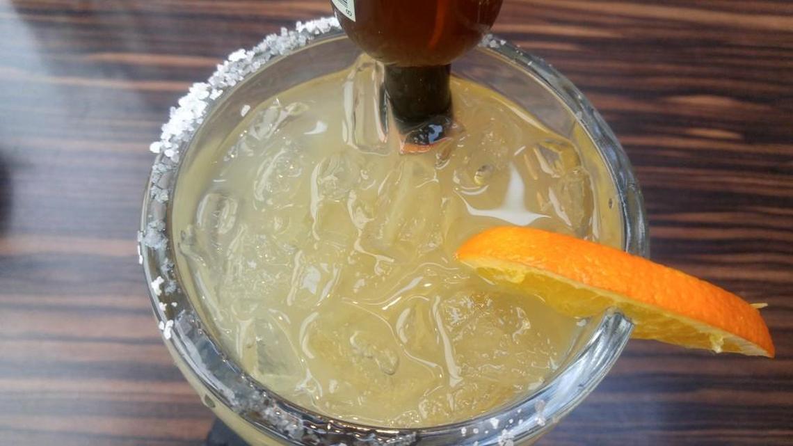 Orange liqueur is added to a margarita to turn it into a Cadillac margarita.