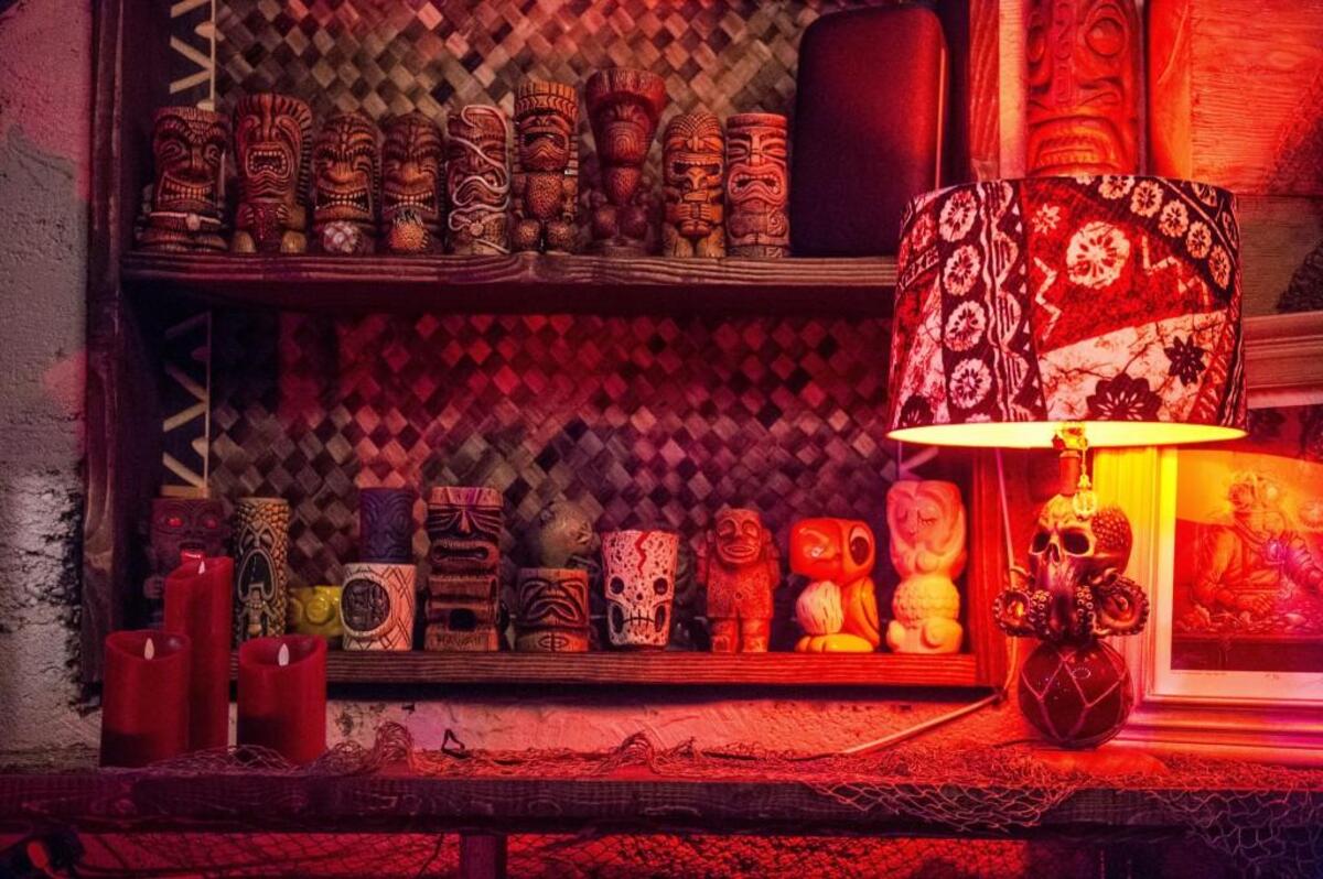 Tiki statues adorn the walls of Devil’s Reef in Tacoma.