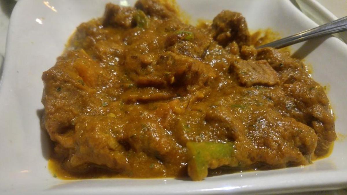 Lamb curry is a spicy stew at Karma Indian Cuisine.