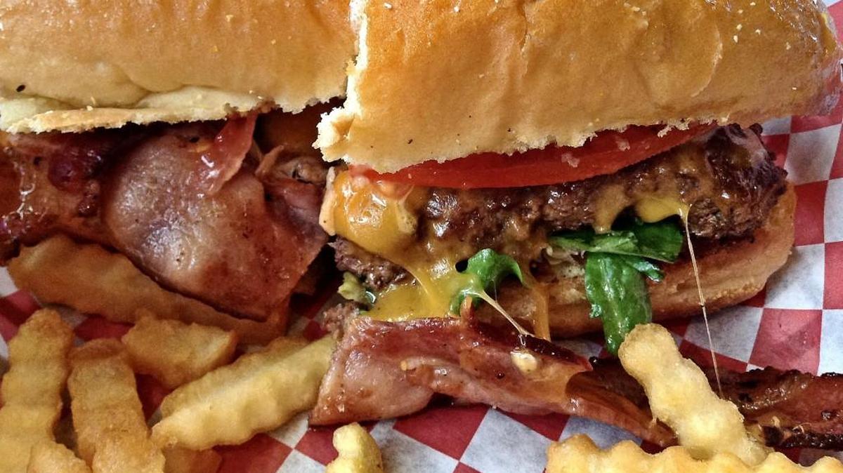 A Smitty burger, with bacon and cheese, from Jubilee in Tacoma’s Lincoln neighborhood. The restaurant closed in 2012, then reopened as a coffee and frozen yogurt shop. Recently, the owner returned to its original menu: burgers.