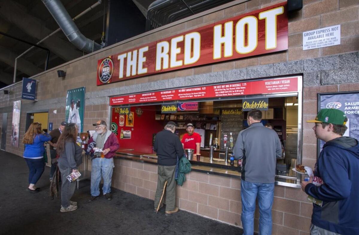 Customers queue up for dogs and brew at The Red Hot concession stand at Cheney Stadium. It's owned by the Miller brothers who operate the main gourmet dog restaurant in Tacoma's Sixth Avenue neighborhood.