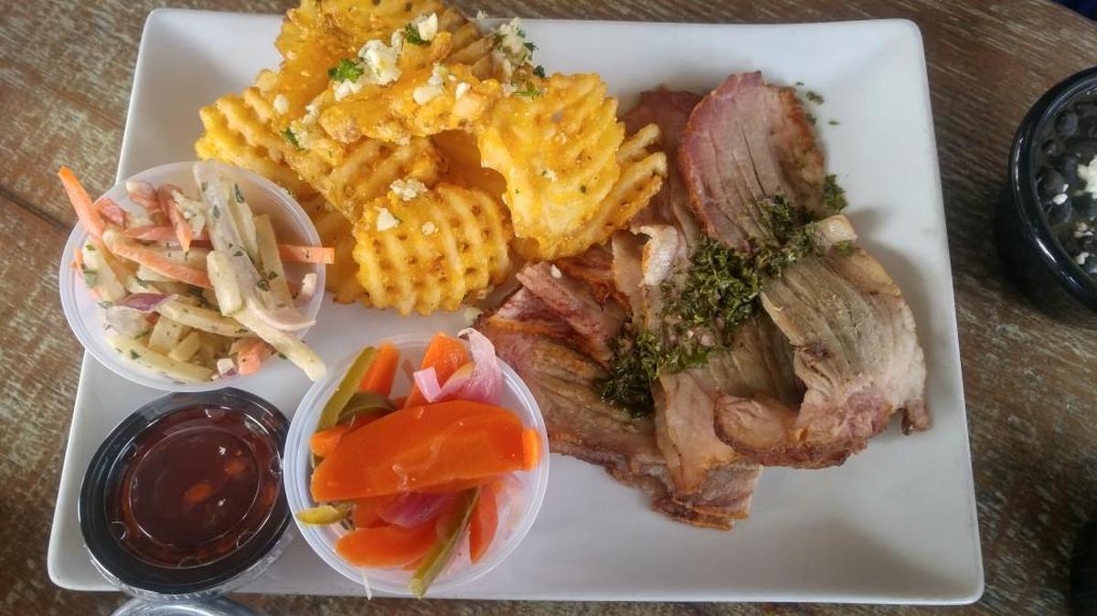 A brisket plate with waffle fries, slaw and pickled vegetables from RoastHouse in Parkland.