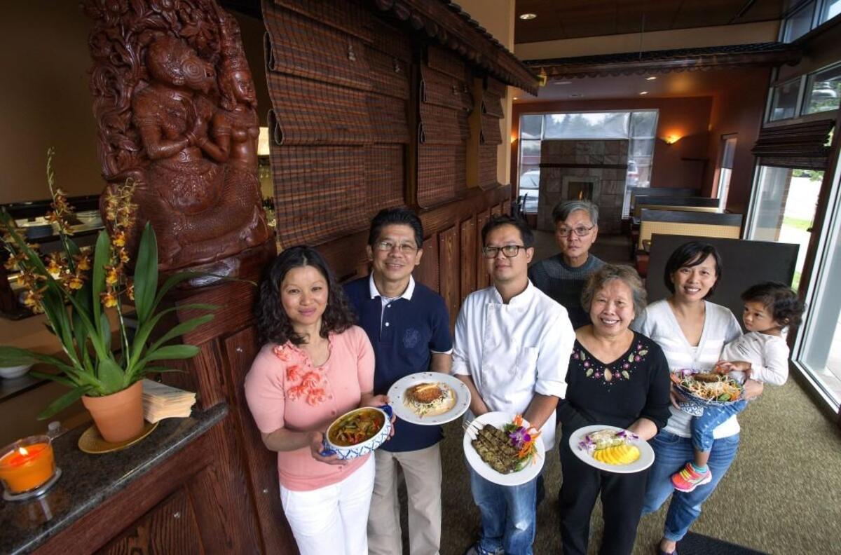 Getting a hand from relatives is common for Hong Ngov and her husband Sean Yean, who operate Fuzion Cafe on Sixth Avenue. Hong’s sister Ly owns Indochine Asian Dining Lounge. Another sister, Buoy, owns Indo Asian Street Eatery. From left: Ngov, Yean, Yu Nanakornphanom, Kim Nay Taing, Chhung Ngov, Buoy Ngov and Ella Nanakornphanom.
