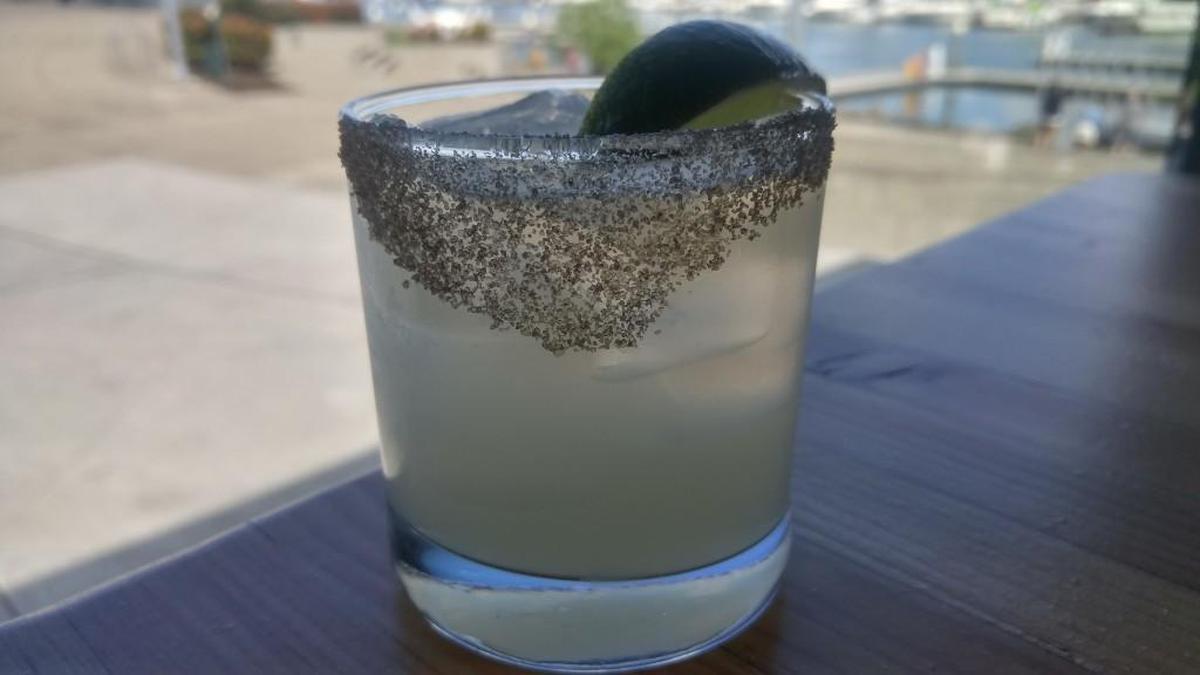 A mezcal cocktail with a smoked salt rim.