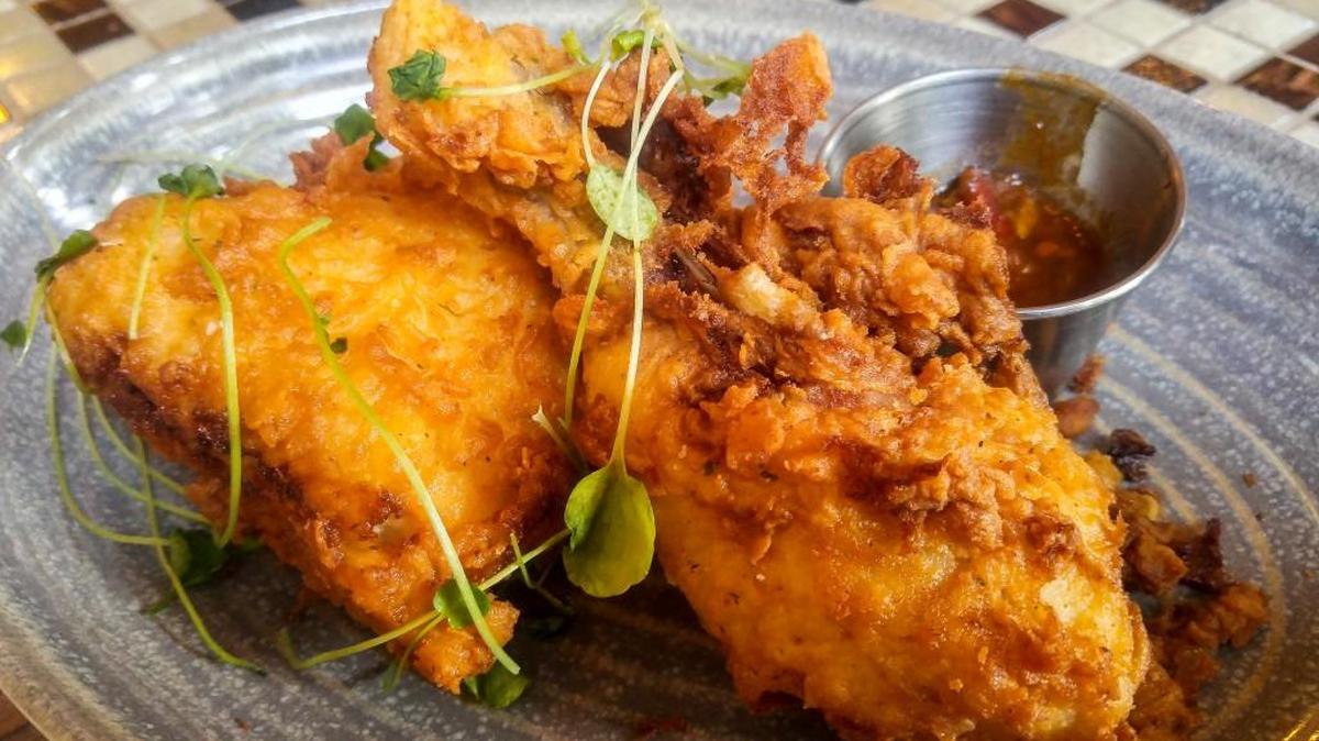 Fried chicken with house-made hot sauce is on the menu at Wilder Local Fare + Libations in downtown Tacoma.