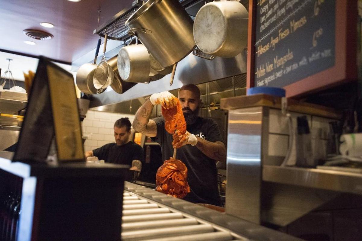 Executive Chef Anthony Hubbard prepares al pastor at Brewers Row in Tacoma.