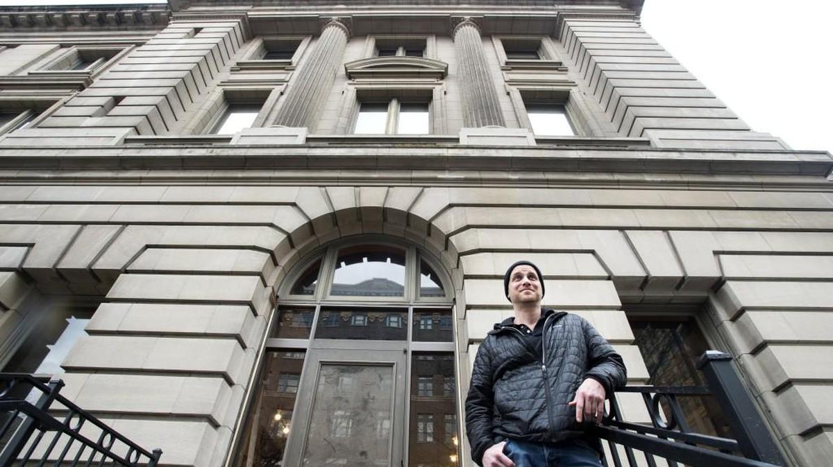 Operator Chris Keil, who previously co-owned Marrow and Hilltop Kitchen, stands outside the entrance of En Rama, a cocktail lounge in downtown Tacoma in the Old Post Office Building. It will open this week.
