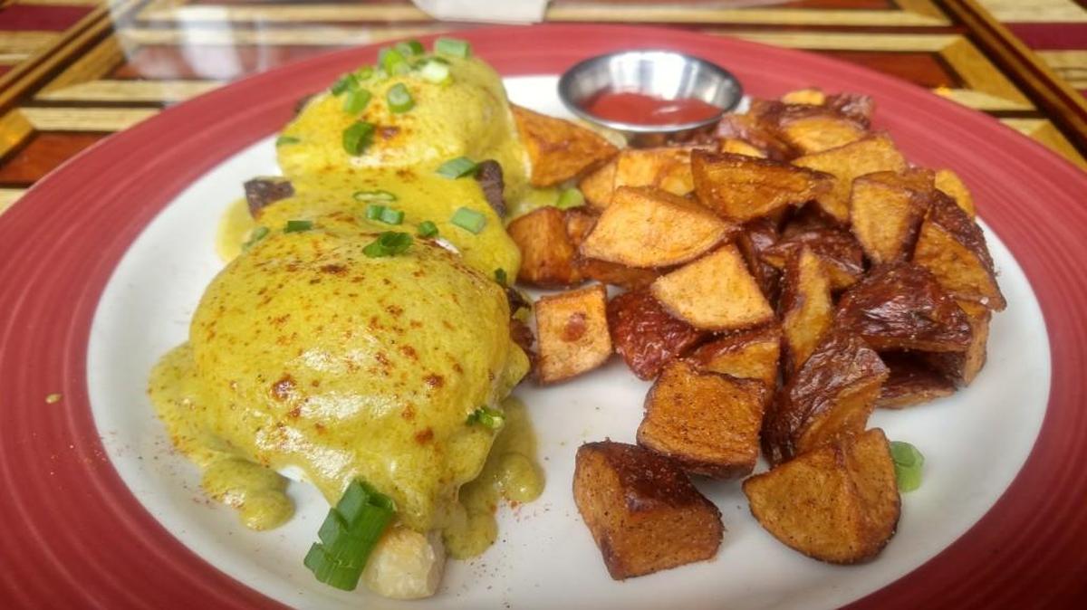The pork belly Benedict with poblano cream sauce at The Matador Tacoma.