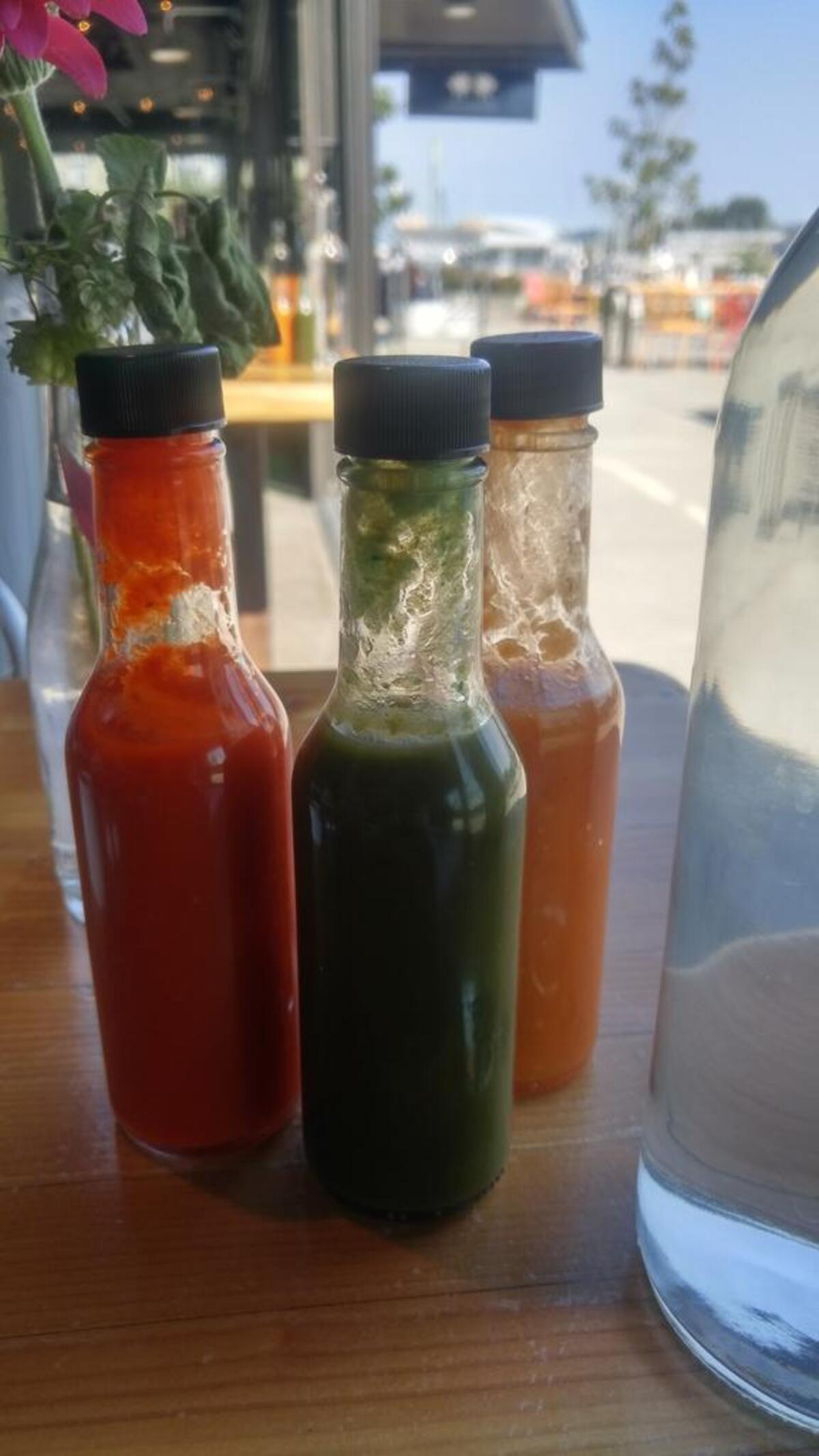 A trio of hot sauce top the tables at Casco Antiguo.