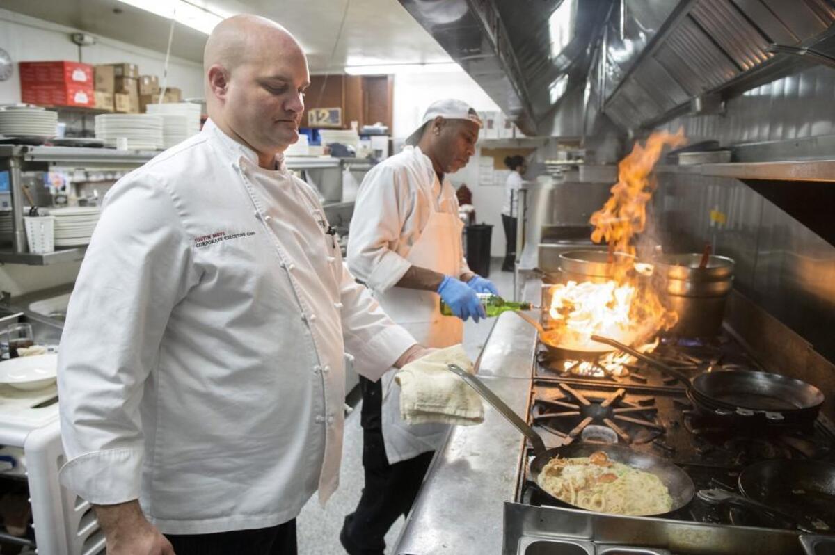Executive chef Justin Mevs prepares an order of lobster carbonara in the kitchen at the Lobster Shop restaurant.