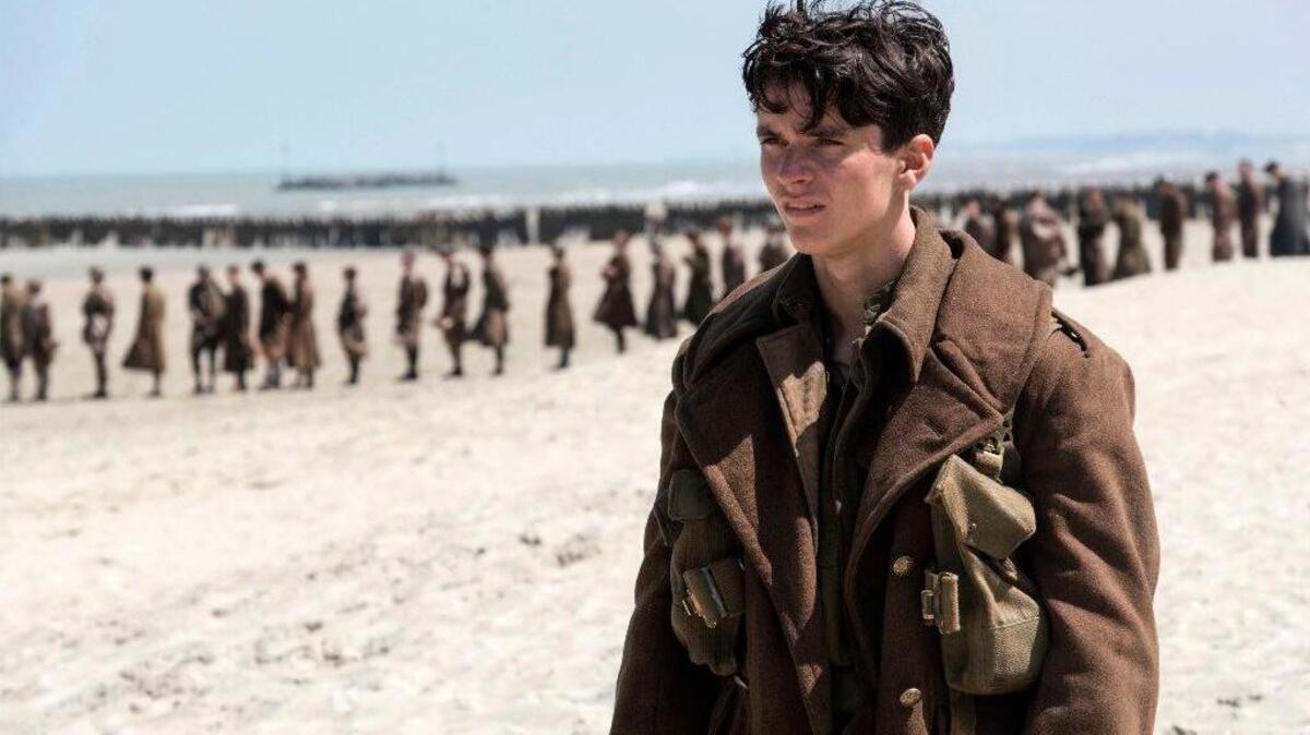 Fionn Whitehead playing a British soldier in a scene from “Dunkirk.”