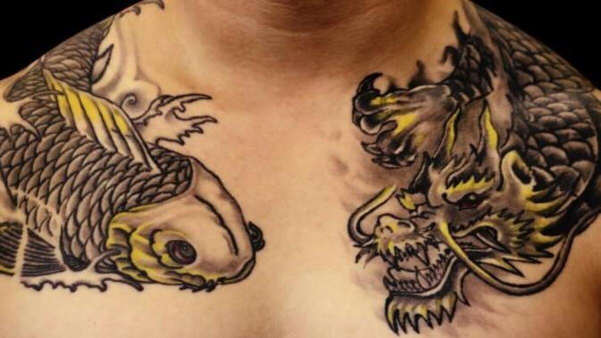 
A koi and dragon tattoo on an anonymous Sergeant First Class Green Beret, part of "Service Ink," now up at White River Valley Museum in Auburn.
