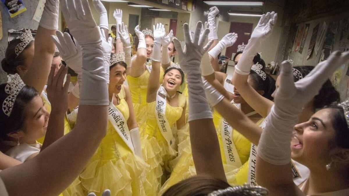 Daffodil princess yell out a cheer before the start of the competition for the daffodil queen title in 2015.