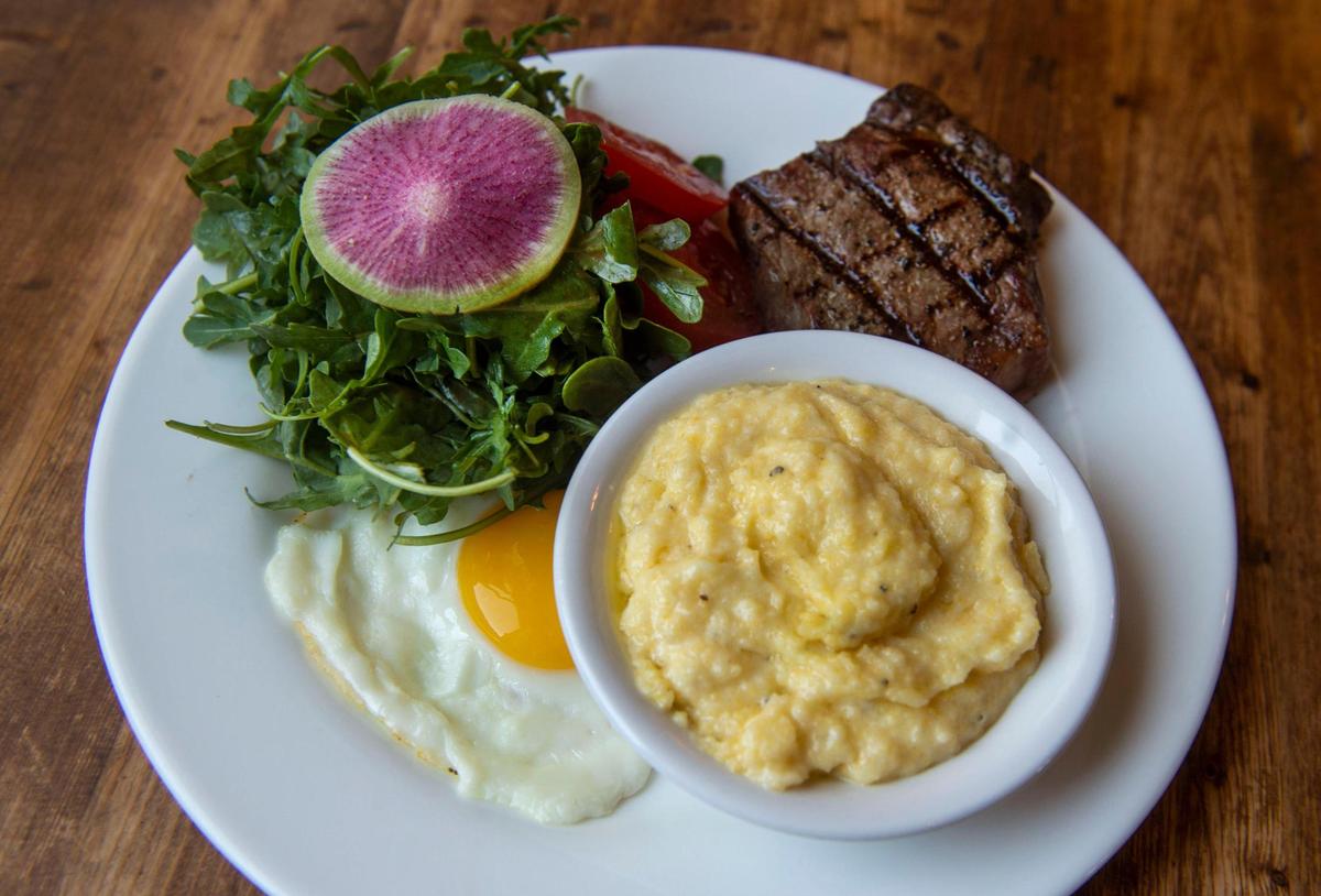 Steak and eggs on the brunch menu at Le SeL Bistro in Tacoma comes with a cut of New York steak, a sunny side egg and aged white cheddar grits. Photo taken on Aug. 5, 2021.