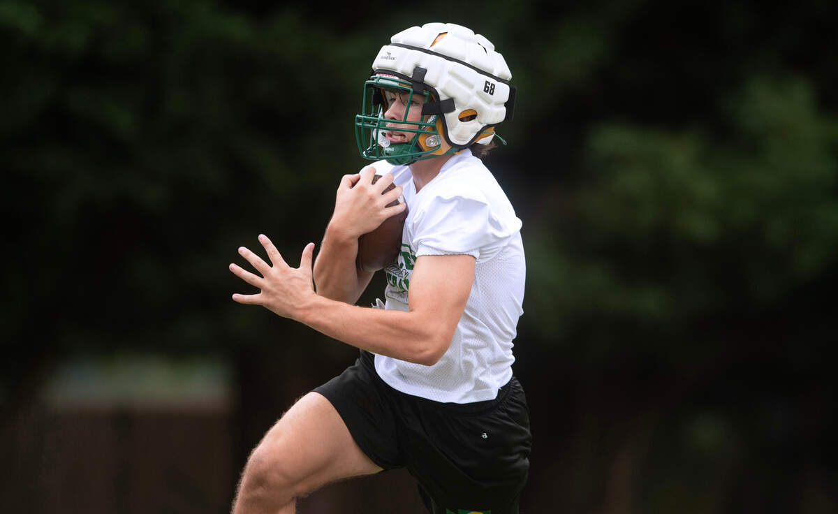 Tumwater running back Cash Short carries the ball during preseason football practice at Tumwater District Stadium in Tumwater, Washington, on Thursday, Aug. 22, 2024.