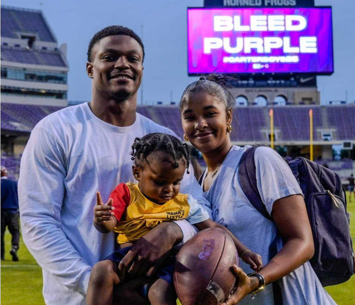 TCU safety, now-Seahawks second-round draft choice Bud Clark with his girlfriend Nesha Cooper and their son Kenzo Clark in the middle after a spring practice at Amon G. Carter Stadium at Texas Christian University in Fort Worth in April 2024.