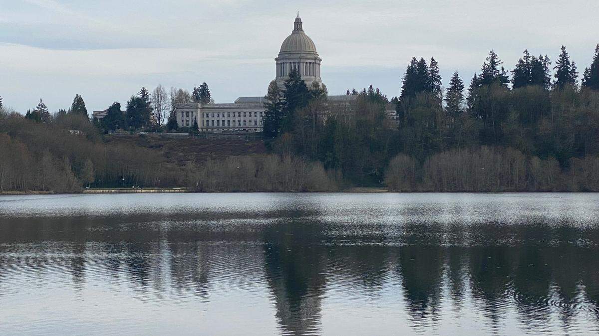 The Capitol Dome of the Legislative Building is reflected off Capitol Lake. The legislative session is scheduled to wrap up April 25, 2021.