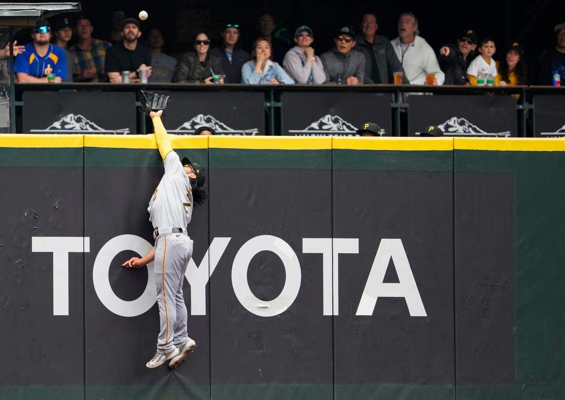 Pittsburgh Pirates left fielder Connor Joe reaches for the solo home run ball from Seattle Mariners’ Julio Rodriguez but can’t make the catch during the first inning of a baseball game Sunday, May 28, 2023, in Seattle. (AP Photo/Lindsey Wasson)