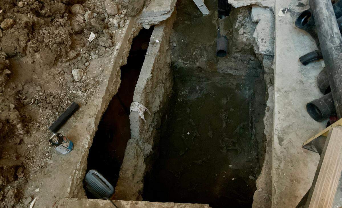 An example of the excavation work required to install a large gravity grease interceptor in the floor of a restaurant. Amor Wine & Tapas dug this hole in early 2023 during a complete renovation of its space on Pacific Avenue downtown.
