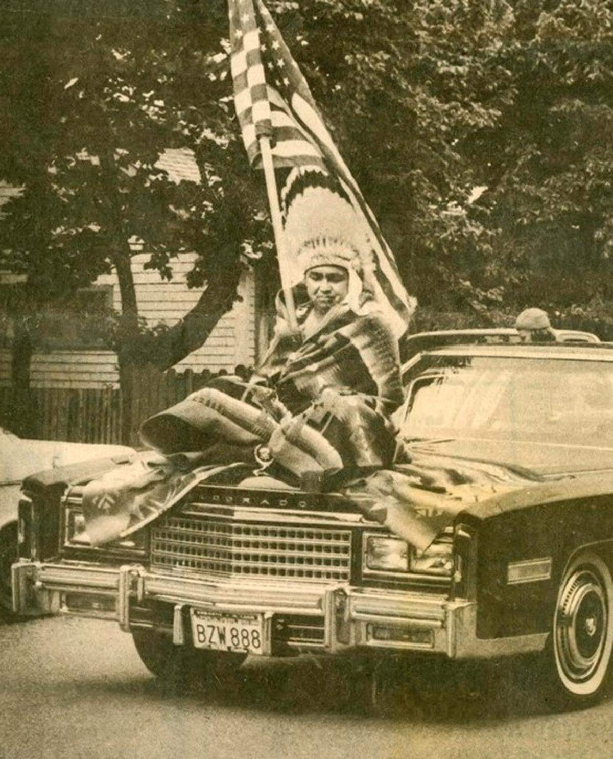 Myrtle Landry’s Cadillac with a family member on the hood was an entry in the 1987 July 4th parade.
