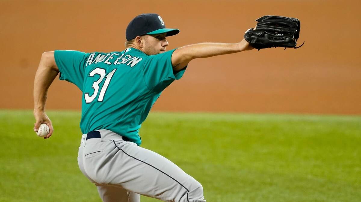 Seattle Mariners starting pitcher Tyler Anderson throws to the Texas Rangers in the first inning of a baseball game in Arlington, Texas, Tuesday, Aug. 17, 2021. (AP Photo/Tony Gutierrez)