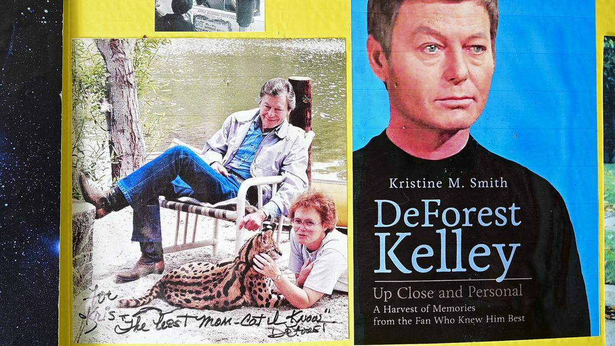 Kris M. Smith is seen with DeForest Kelley in a picture that was given to her by Kelley alongside the cover the book she wrote about the actor who played Dr. Leonard “Bones” McCoy on the original Star Trek series.