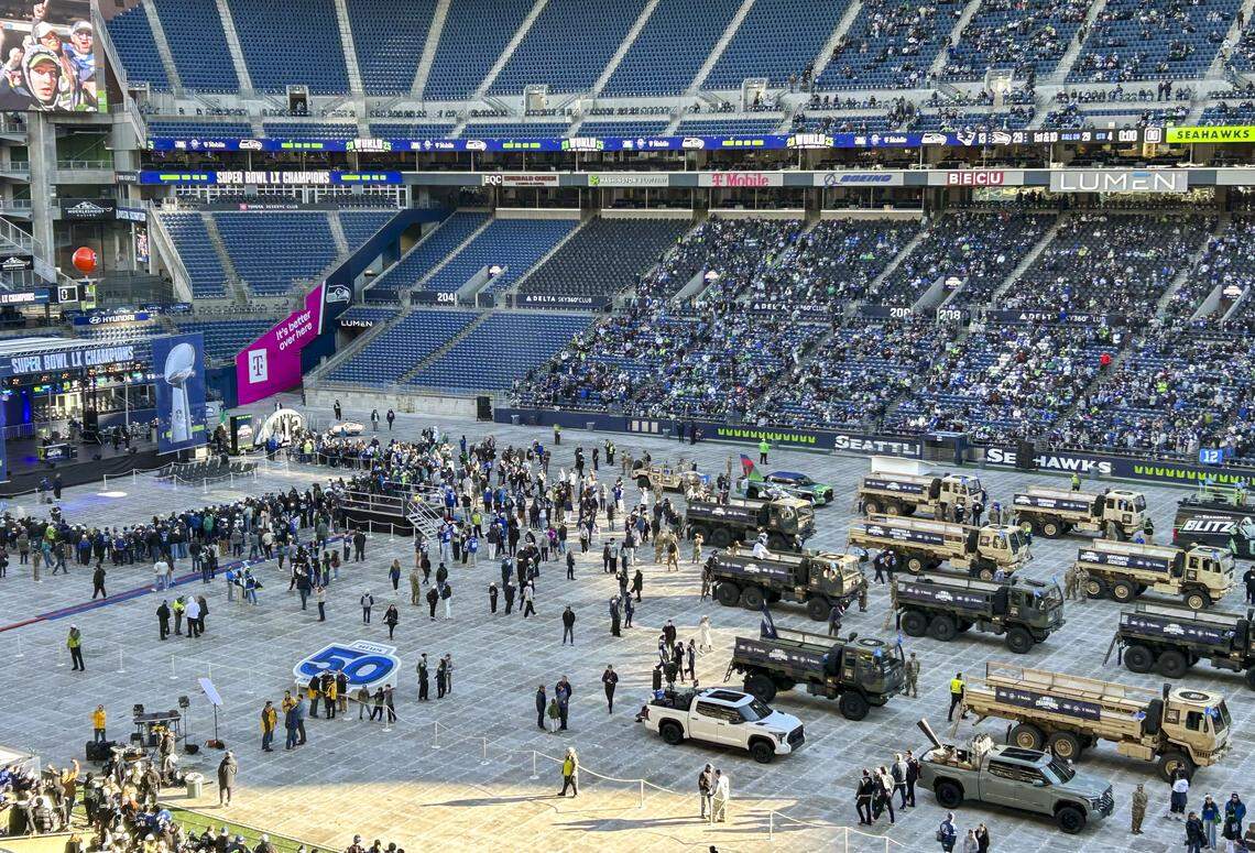 Army HEMTT vehicles will be the mode of transport for the Seahawks in the parade. Staged here in Lumen Field in front of for the Super Bowl LX Champions stage on the field for the stadium event.