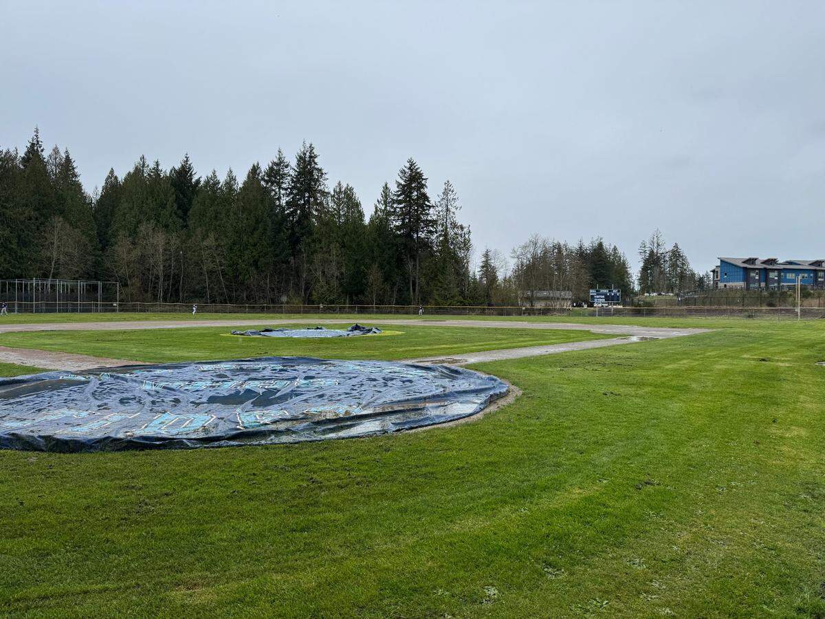 A tarp partially covers the Gig Harbor High School baseball field on Thursday, March 27, 2025, in Gig Harbor.