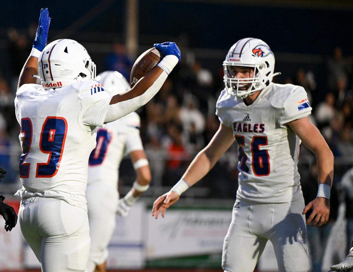 Graham-Kapowsin’s Alele Fa’apito-leao (29) celebrates a touchdown against the Sumner Spartans during the first half of the game at Sumner High School, Thursday, Sept. 28, 2023, in Sumner, Wash.
