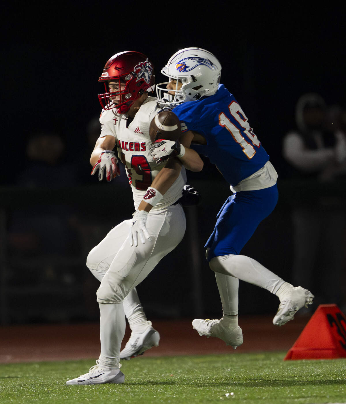 Graham Kapowsin wide receiver George Woods (18) breaks up a pass intended for Kennedy Catholic running back Brayden Seiber (19) during the first half of the opening round 4A state tournament game at Art Crate Field, on Saturday, Nov. 15, 2025, in Spanaway, Wash.
