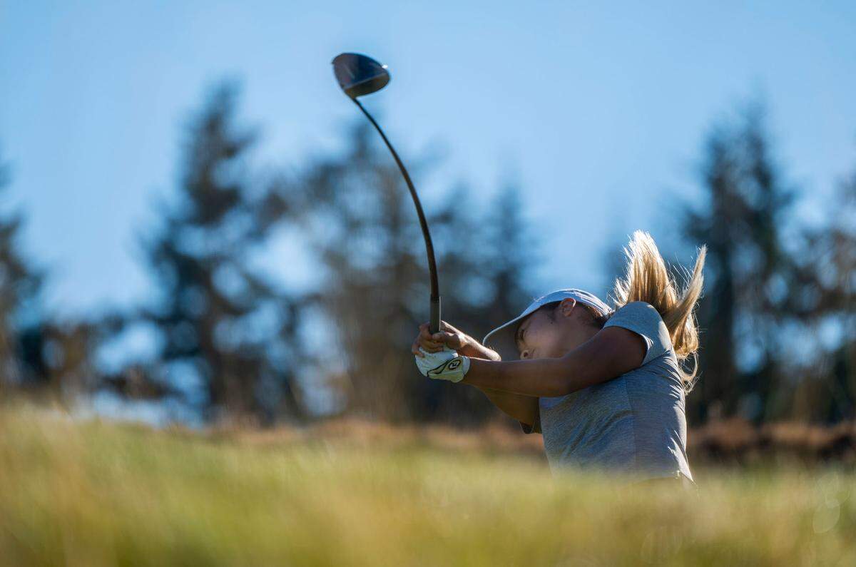 Jennifer Gu from Canada tees the ball while competing in the 122nd U.S. Women’s Amateur Championship at Chambers Bay Golf Course in University Place on Aug. 8, 2022.