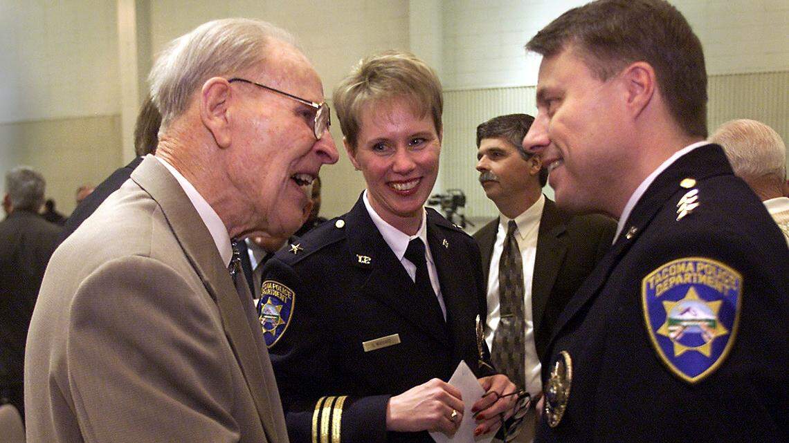 Tacoma police chief David Brame greets a well-wisher following his swearing-in ceremony in a file photo from January 17, 2002. In the background is assistant police chief Catherine Woodard. 