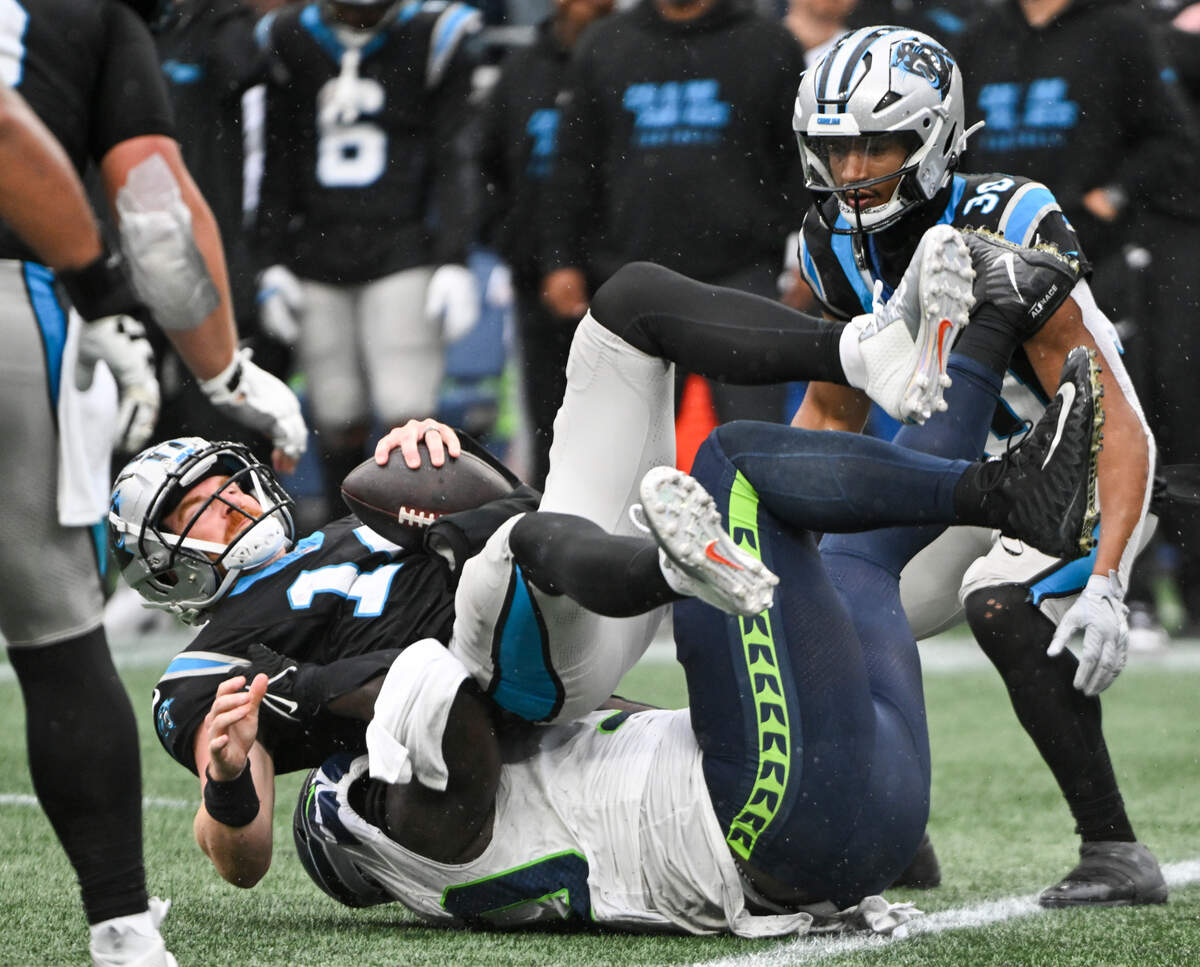 Seattle Seahawks defensive tackle Jarran Reed (90) sacks Carolina Panthers quarterback Andy Dalton (14) on a fourth down during the fourth quarterof the game at Lumen Field, Sunday, Sept. 24, 2023, Seattle, Wash.