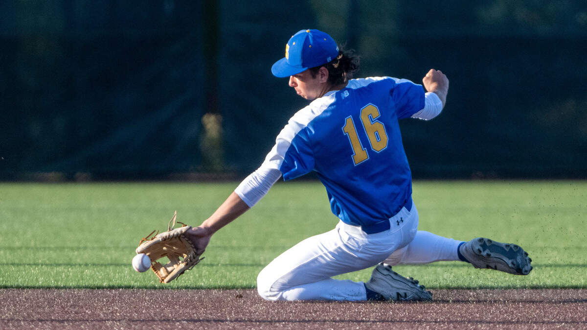 Stadium shortstop Bennett Nieraeth makes a sliding stop on a Timberline ground ball during the bottom of the first inning of the 3A West Central/Southwest district baseball championship game at Auburn High School on Saturday, May 13, 2023, in Auburn, Wash.