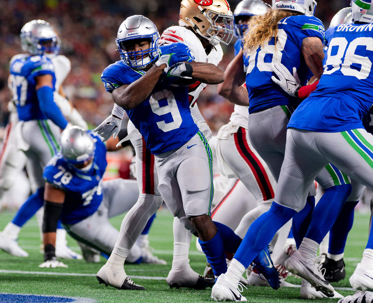 Seattle Seahawks running back Kenneth Walker III (9) runs in a touchdown against the San Francisco 49ers during the third quarter of the game at Lumen Field, on Thursday, Oct. 10, 2024, in Seattle, Wash.