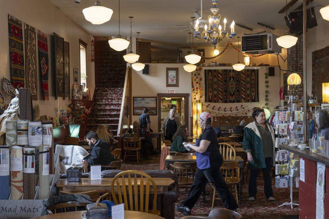 Employees and customers move about Antique Sandwich Co. on Tuesday, April 14, 2026, in Tacoma.