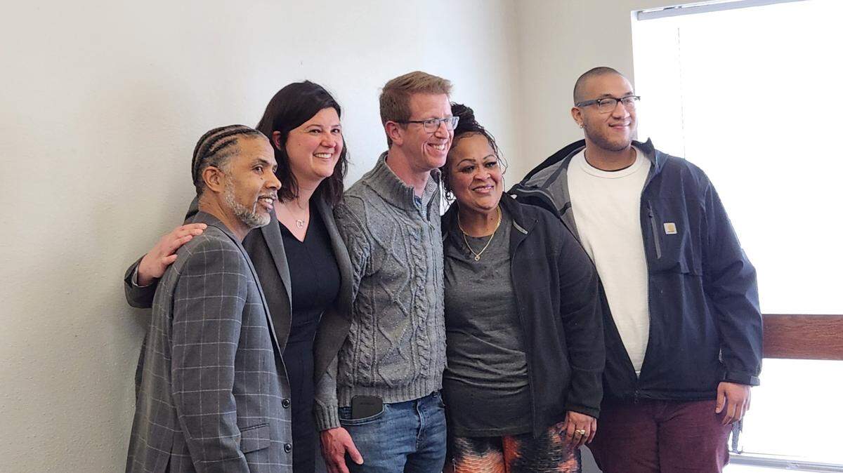 From left, James Watson, Kristina Walker, Derek Kilmer, Candace Wesley and Xavier Vaughn pose for a photo following a meeting April 21 at Peace Community Center in Tacoma.