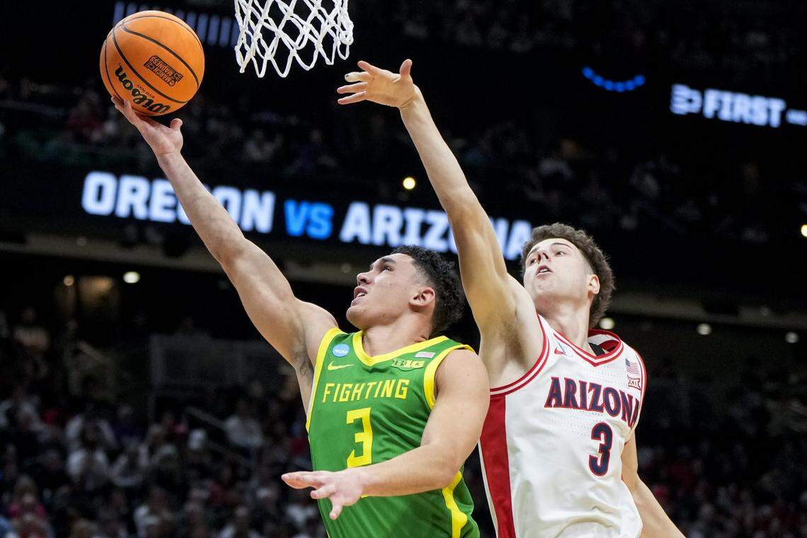 Mar 23, 2025; Seattle, WA, USA;  Oregon Ducks guard Jackson Shelstad (3) drives to the basket against Arizona Wildcats guard Anthony Dell'Orso (3) in the second half at Climate Pledge Arena. Mandatory Credit: Stephen Brashear-Imagn Images