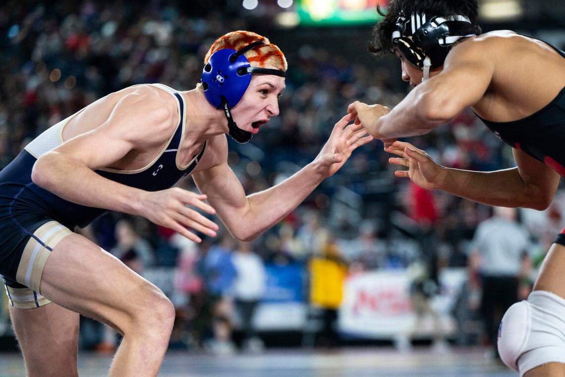 Sumner Cody Miller wrestles Sunnyside Christopher Villanueva during the 145-pound 4A quarterfinal match at Mat Classic XXXIV on Friday, Feb. 17, 2023, at the Tacoma Dome in Tacoma, Wash. Miller defeated Villanueva 13-2.