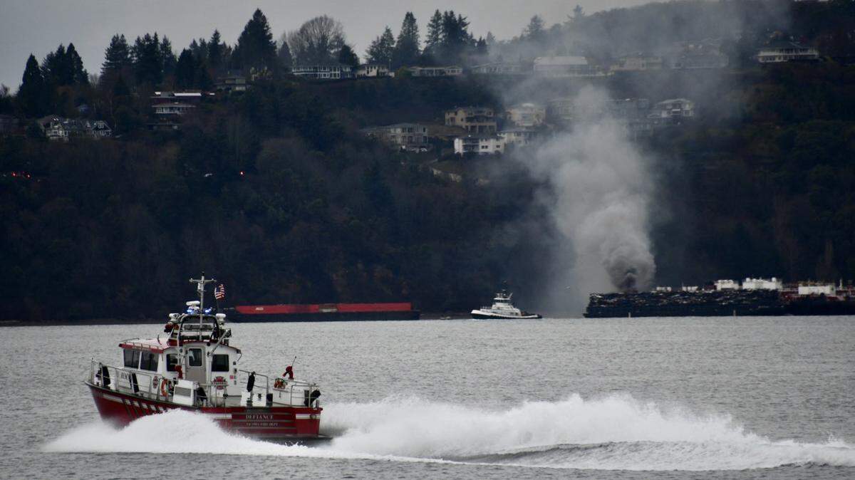 Tacoma Fire Department deployed its fire boat, Defiance to battle a scrap metal fire Monday morning on a barge in Commencement Bay.