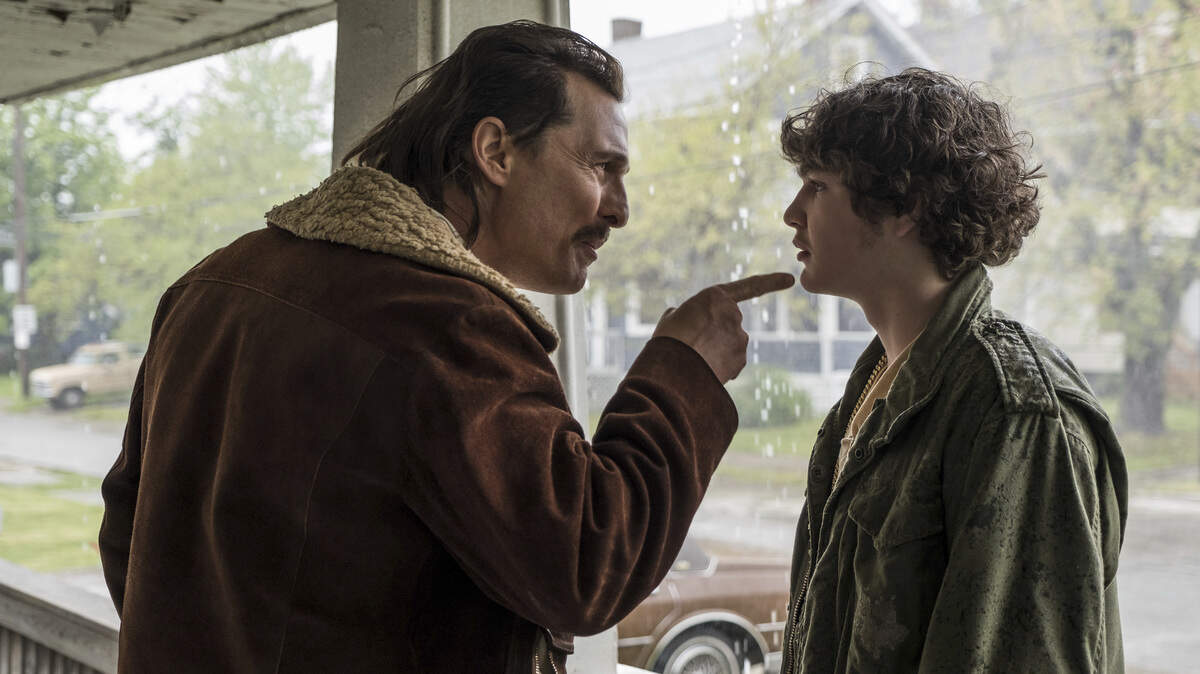 First-time actor Richie Merritt, right, plays a teenager who became an FBI informant to protect his father, a low-level gun dealer portrayed by Matthew McConaughey, in “White Boy Rick.”