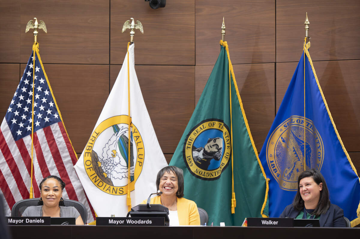 Tacoma City Council members, including Deputy Mayor Kiara Daniels, left, Mayor Victoria Woodards, center, and Kristina Walker, right, take part in a council meeting on Tuesday, June 24, 2025, in Tacoma.