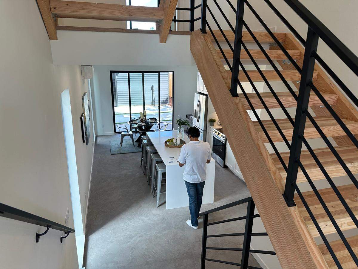 Don Bora of Smart Build is seen in the kitchen of one of four homes the real estate-construction firm is offering for sale near North 48th and North Pearl streets in Tacoma.