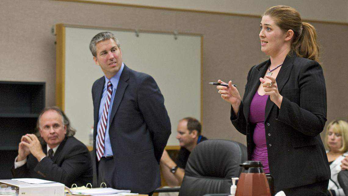 Former Tacoma Public Schools attorney Shannon McMinimee, right, makes an argument to Pierce County Superior Court Judge Bryan Chushcoff in a hearing Sept. 16, 2011. McMinimee, who left the district in 2016, has sued for breach of contract in a dispute over her departure.