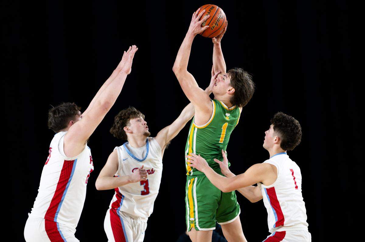 Richland’s Landon Northrop (1) goes up for a contested basket against West Valley during the second half of a Class 4A state basketball tournament quarterfinal game at the Tacoma Dome on Thursday, March 6, 2025, in Tacoma, Wash.