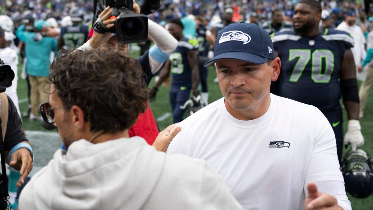 Seattle Seahawks head coach Mike Macdonald and Miami Dolphins head coach Mike McDaniel shake hands after the Seattle Seahawks 24-3 victory at Lumen Field, on Sunday, Sept. 22, 2024, in Seattle, Wash.