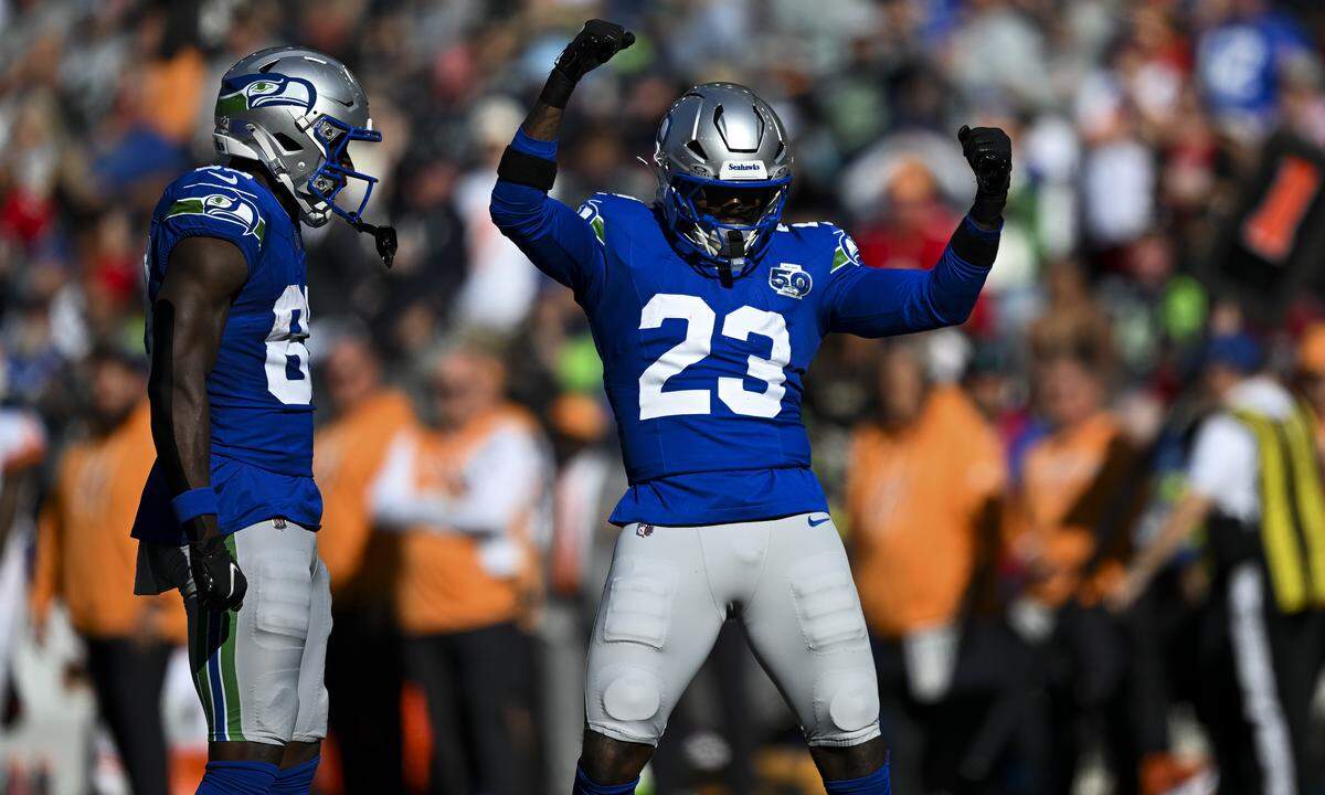 Seattle Seahawks safety D'Anthony Bell (23) reacts to a big hit on a kick against the Tampa Bay Buccaneers return during the third quarter of the game at Lumen Field, on Sunday, Oct. 5, 2025, in Seattle.