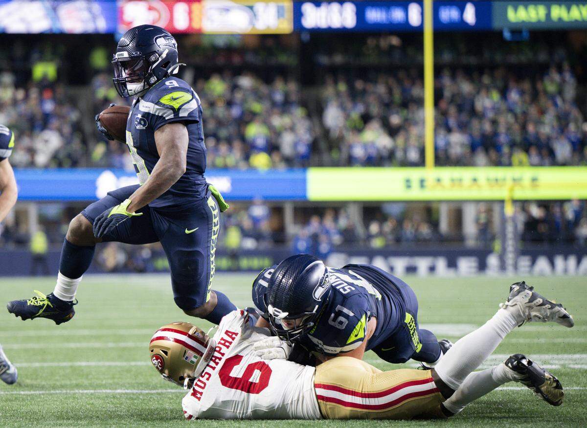 Seattle Seahawks center Jalen Sundell (61) pancakes San Francisco 49ers safety Malik Mustapha (6) as Kenneth Walker III scores his third touchdown during the fourth quarter of the NFC Divisional Round game at Lumen Field, on Saturday, Jan. 17, 2026, in Seattle.