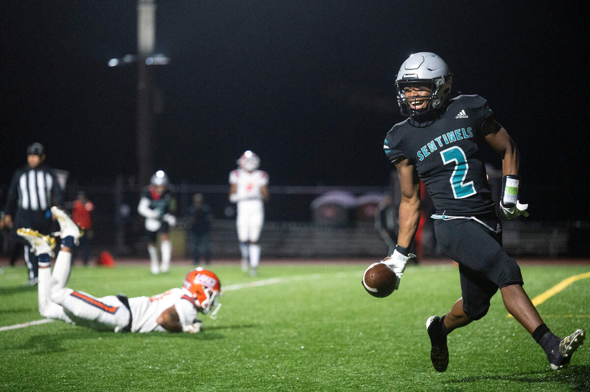 After weaving his way through the Lakes defense, Spanaway Lake running back Joshua Collie smiles after reaching the end zone for a touchdown in the second quarter of a 3A Pierce County League game on Friday at Art Crate Field in Spanaway. Spanaway Lake beat Lakes, 32-21.
