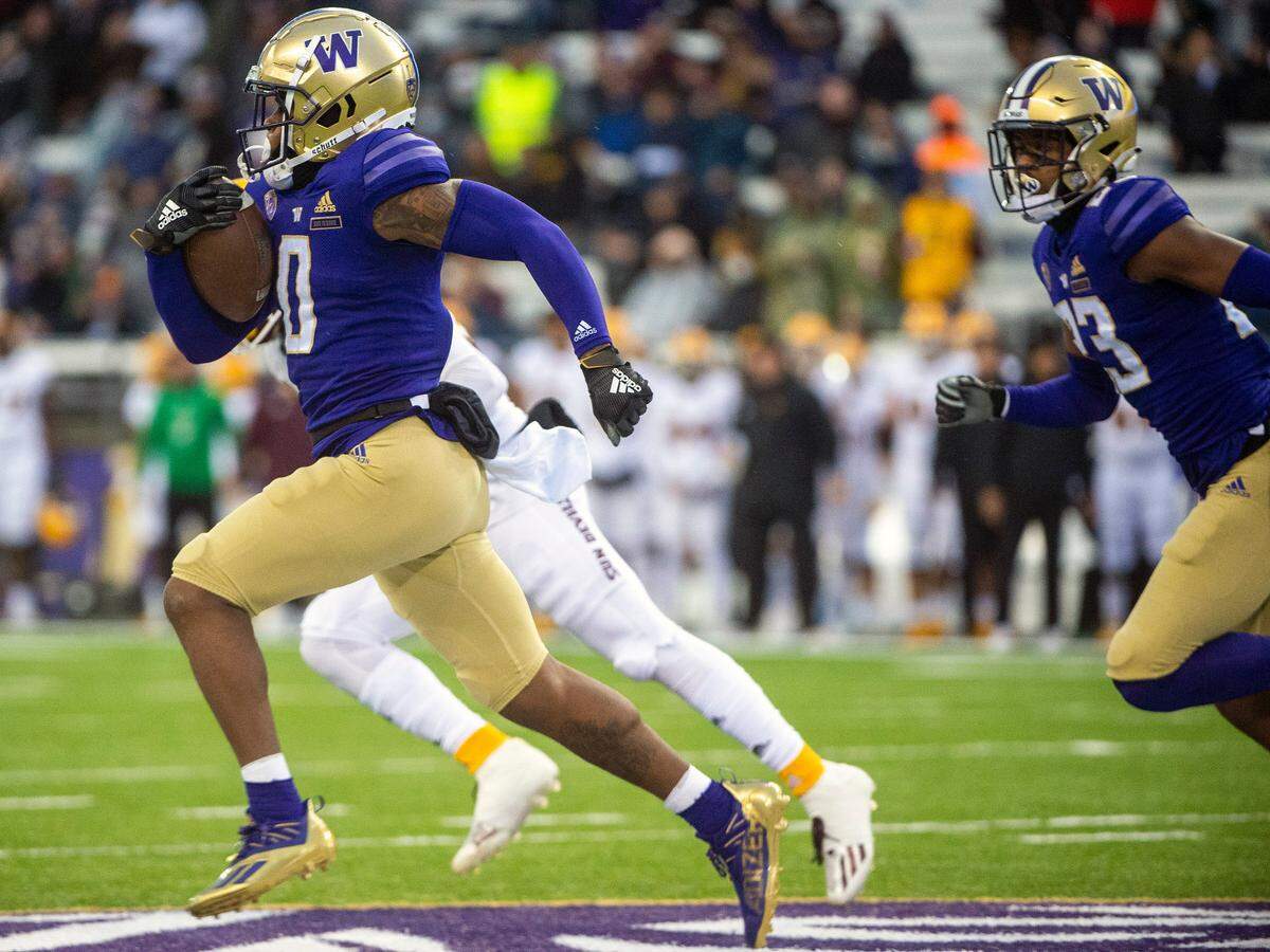 Washington wide receiver Giles Jackson (0) returns the opening kick-off for a big gain during the first quarter of a Pac-12 game against Arizona State on Saturday evening at Husky Stadium in Seattle.